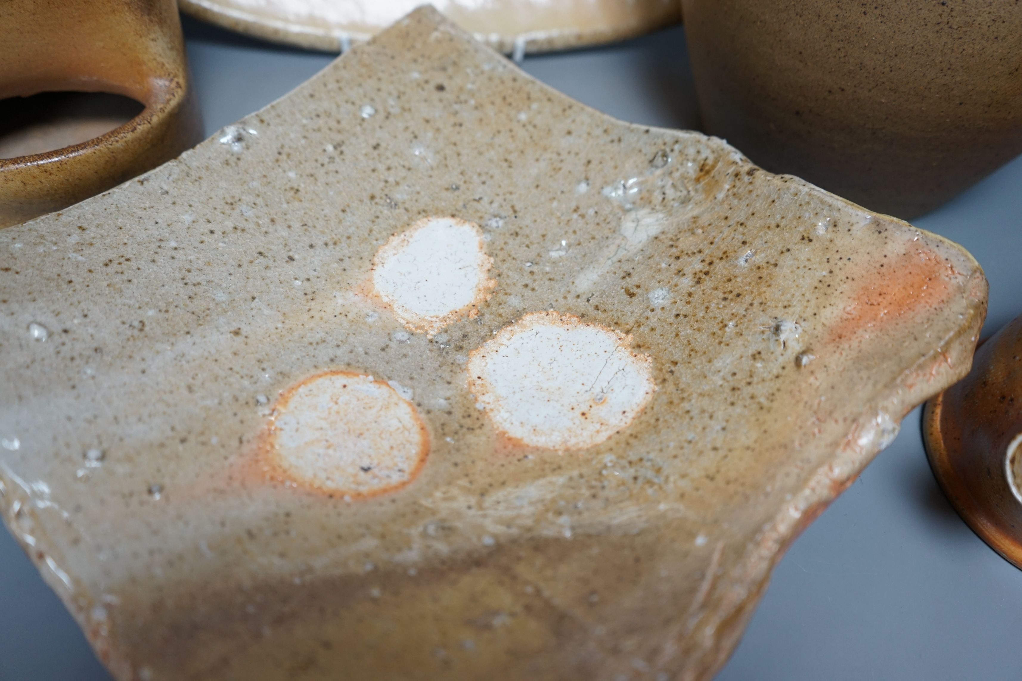British studio pottery; a group to include a Micki Schloessingk (b.1949) salt glaze teapot and cover, together with other similar items and other studio pottery wares, largest 39cm wide, (5)